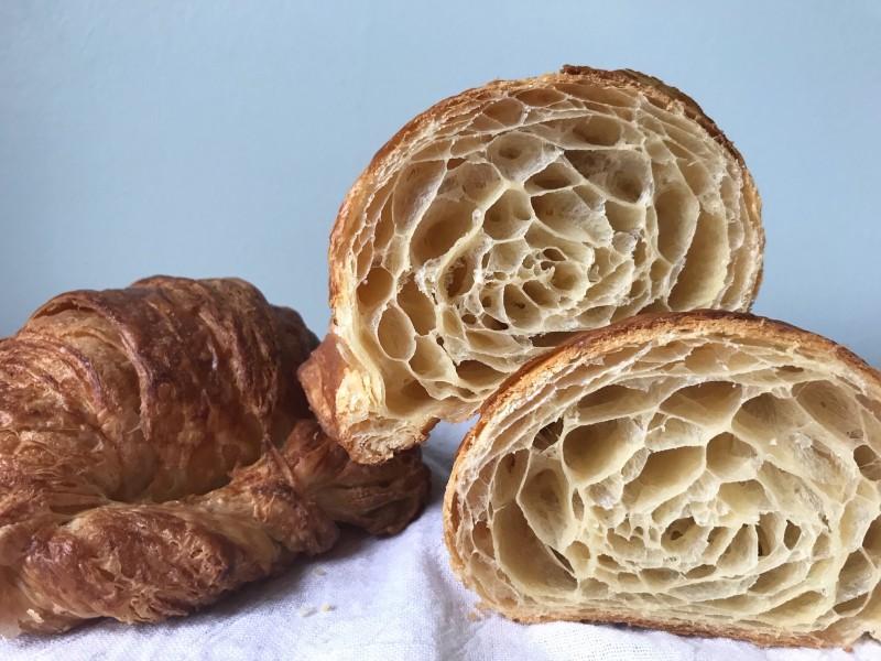 one whole croissant and one croissant cut in half