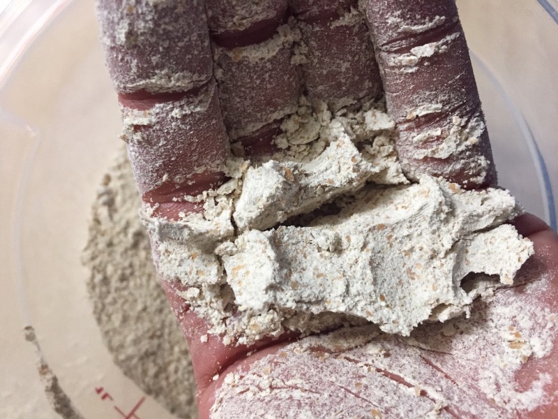 freshly milled flour in Randy's hand