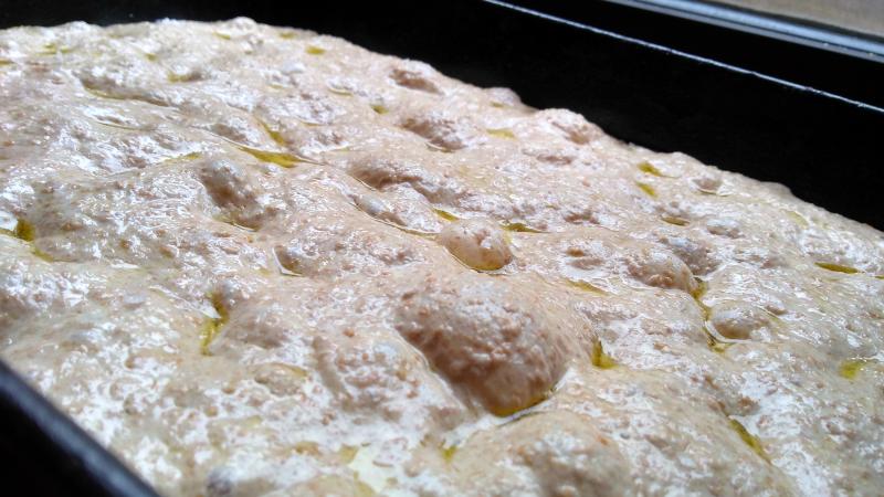 A bubbly pan of proofing focaccia dough