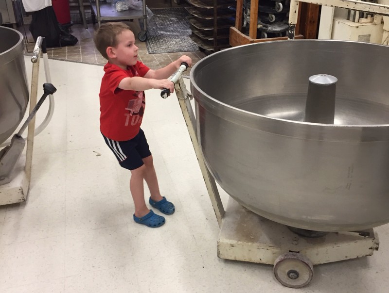 Randy's child pulling a big bowl of dough
