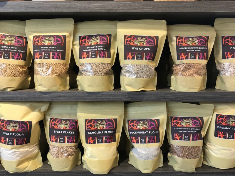 bags of freshly milled flour and grains in the Bakeshop