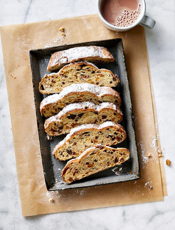 Stollen bread cut into slices on a baking sheet