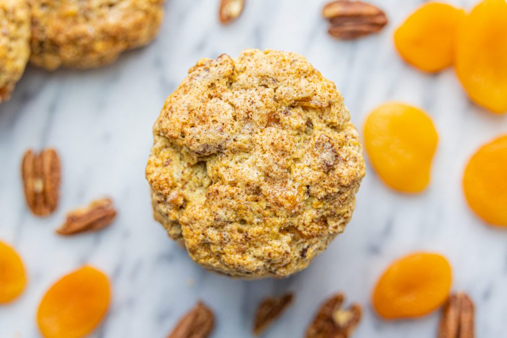 Toasted Oat, Pecan & Flaxseed Scones with apricots and pecans scattered around