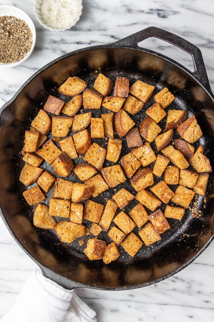 croutons in a cast-iron pan