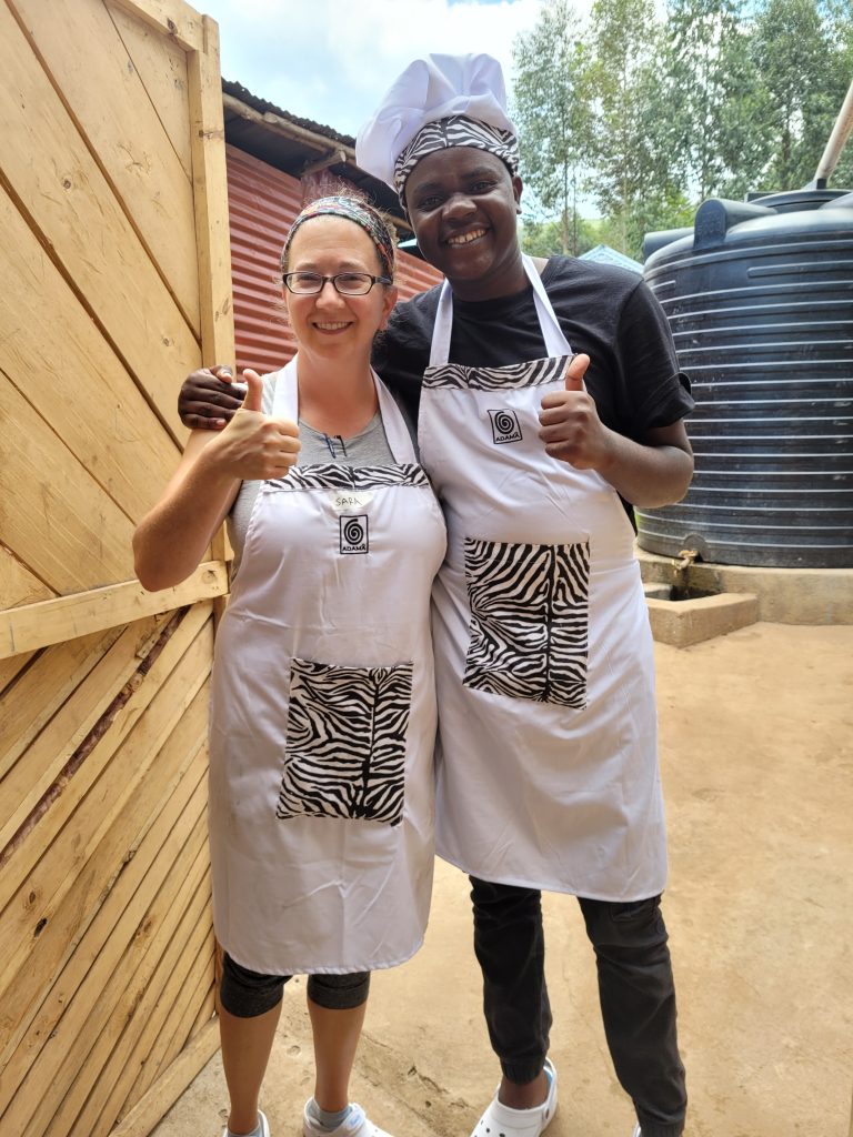 sara with a student at the bakery