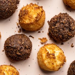 Ari's Pick: Marvelous Coconut Macaroons An overhead view of chocolate and vanilla coconut macaroons arranged in a checkerboard pattern on a pale pink speckled surface