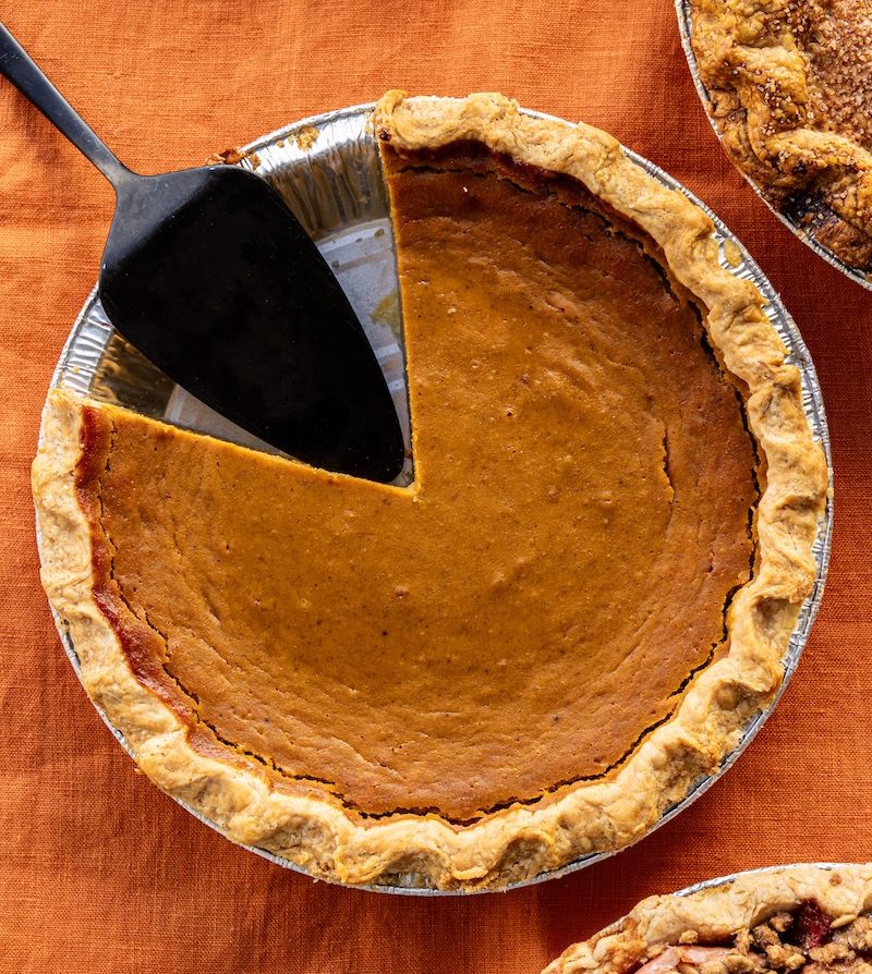 pumpkin pie with a portion removed