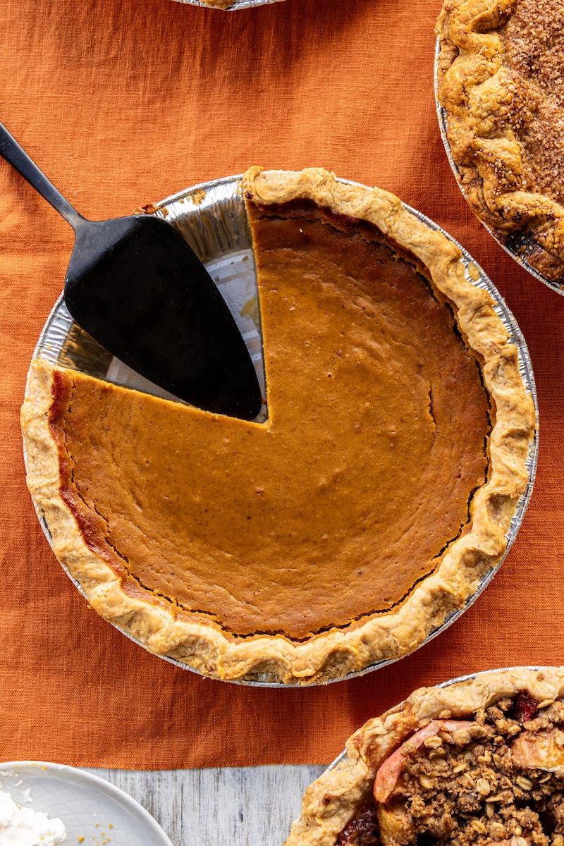 pumpkin pie with a portion removed