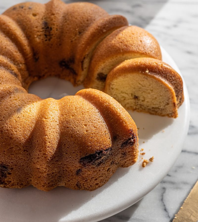 sour cream coffee cake on a cake stand